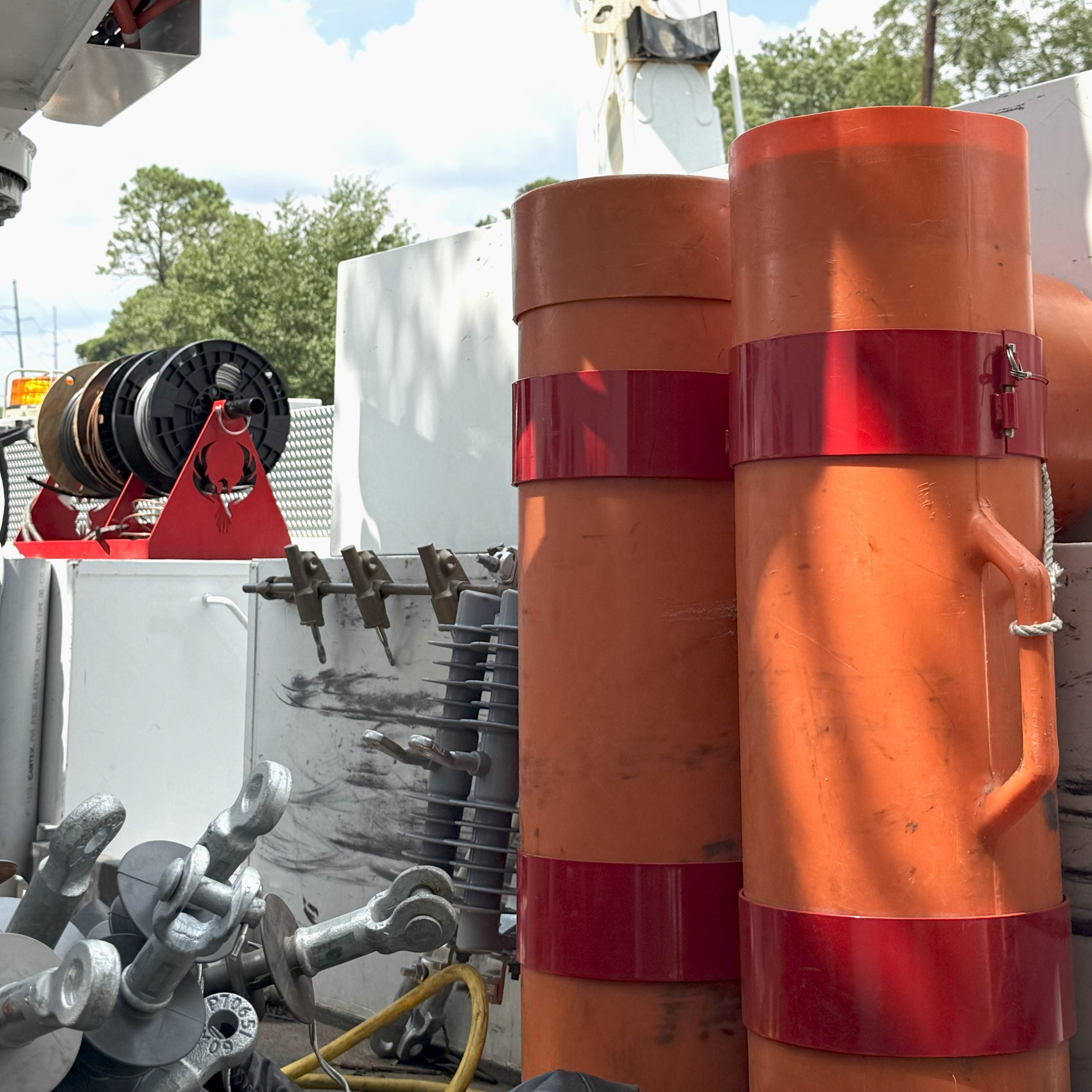 Insulating Blanket Canister Storage for Utility Bucket Trucks